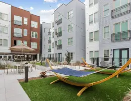 an outdoor courtyard with hammocks